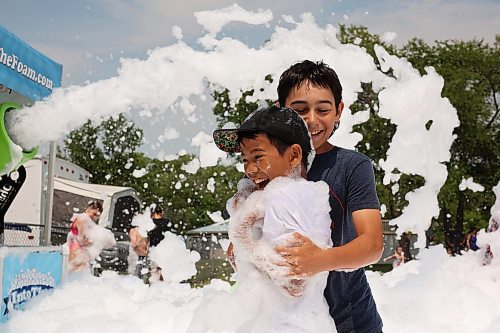 18072024
Kids beat the heat playing in a foam party during the Hamiota Agricultural Society Fair on a hot Thursday afternoon. The fair included a mini golf tournament, a Mario Kart tournament, beach volleyball and baseball, a movie night, livestock shows and a variety of other entertainment and activities.
(Tim Smith/The Brandon Sun)