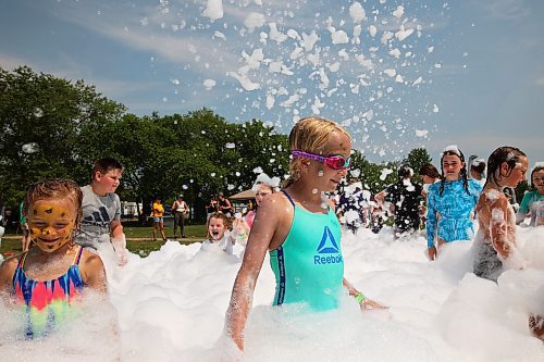 18072024
Kids beat the heat playing in a foam party during the Hamiota Agricultural Society Fair on a hot Thursday afternoon. The fair included a mini golf tournament, a Mario Kart tournament, beach volleyball and baseball, a movie night, livestock shows and a variety of other entertainment and activities.
(Tim Smith/The Brandon Sun)