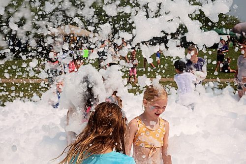 18072024
Kids beat the heat playing in a foam party during the Hamiota Agricultural Society Fair on a hot Thursday afternoon. The fair included a mini golf tournament, a Mario Kart tournament, beach volleyball and baseball, a movie night, livestock shows and a variety of other entertainment and activities.
(Tim Smith/The Brandon Sun)