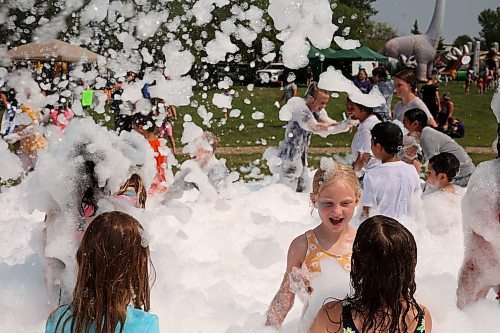 18072024
Kids beat the heat playing in a foam party during the Hamiota Agricultural Society Fair on a hot Thursday afternoon. The fair included a mini golf tournament, a Mario Kart tournament, beach volleyball and baseball, a movie night, livestock shows and a variety of other entertainment and activities.
(Tim Smith/The Brandon Sun)