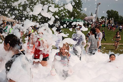 18072024
Kids beat the heat playing in a foam party during the Hamiota Agricultural Society Fair on a hot Thursday afternoon. The fair included a mini golf tournament, a Mario Kart tournament, beach volleyball and baseball, a movie night, livestock shows and a variety of other entertainment and activities.
(Tim Smith/The Brandon Sun)