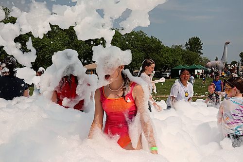 18072024
Kids beat the heat playing in a foam party during the Hamiota Agricultural Society Fair on a hot Thursday afternoon. The fair included a mini golf tournament, a Mario Kart tournament, beach volleyball and baseball, a movie night, livestock shows and a variety of other entertainment and activities.
(Tim Smith/The Brandon Sun)