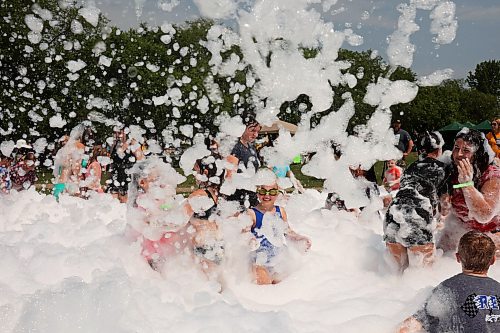 18072024
Kids beat the heat playing in a foam party during the Hamiota Agricultural Society Fair on a hot Thursday afternoon. The fair included a mini golf tournament, a Mario Kart tournament, beach volleyball and baseball, a movie night, livestock shows and a variety of other entertainment and activities.
(Tim Smith/The Brandon Sun)