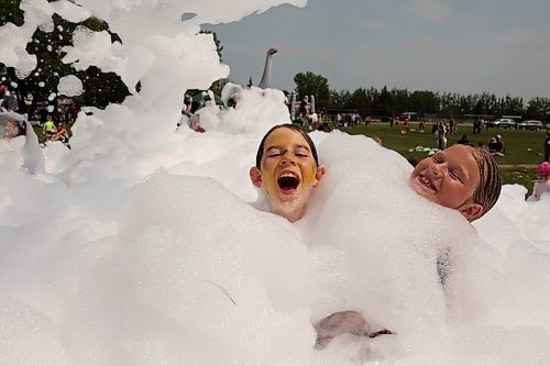 18072024
Kids beat the heat playing in a foam party during the Hamiota Agricultural Society Fair on a hot Thursday afternoon. The fair included a mini golf tournament, a Mario Kart tournament, beach volleyball and baseball, a movie night, livestock shows and a variety of other entertainment and activities.
(Tim Smith/The Brandon Sun)