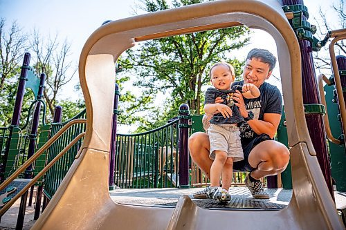 NIC ADAM / FREE PRESS
Cliff Tesoro, and his two-year-old son Castiel, have fun at St. Vital Park&#x2019;s playground Thursday afternoon.
240718 - Thursday, July 18, 2024.

Reporter: ?