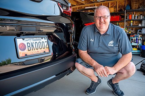 NIC ADAM / FREE PRESS
Adam Wedlake, Executive Director of Basketball Manitoba, pictured next to his basketball licence plate Thursday afternoon. His is the second the province ever made.
240718 - Thursday, July 18, 2024.

Reporter: Jura