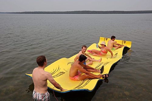 19072024
Swimmers enjoy the hot weather on a floating raft at Clear Lake on Friday.
(Tim Smith/The Brandon Sun)
