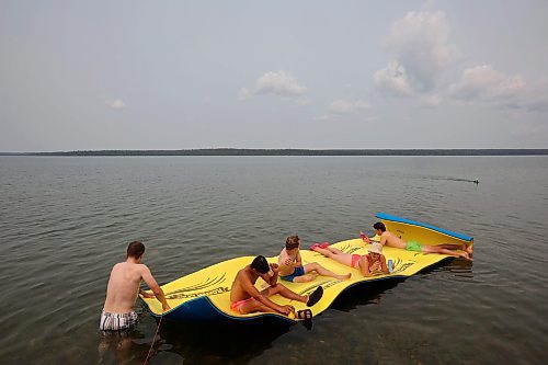 19072024
Swimmers enjoy the hot weather on a floating raft at Clear Lake on Friday.
(Tim Smith/The Brandon Sun)
