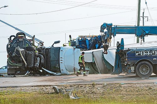 NIC ADAM / FREE PRESS
The aftermath of a collision between a car and tractor trailer at the intersection of hwy 75 and hwy 210 Friday afternoon. The Semi truck driver walked away with bruises while the other driver was rushed to hospital.
240719 - Friday, July 19, 2024.

Reporter: ?