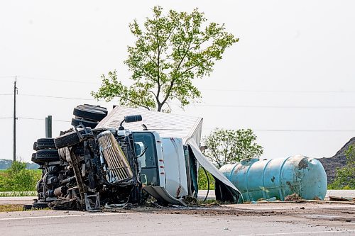 NIC ADAM / FREE PRESS
The aftermath of a collision between a car and tractor trailer at the intersection of hwy 75 and hwy 210 Friday afternoon. The Semi truck driver walked away with bruises while the other driver was rushed to hospital.
240719 - Friday, July 19, 2024.

Reporter: ?