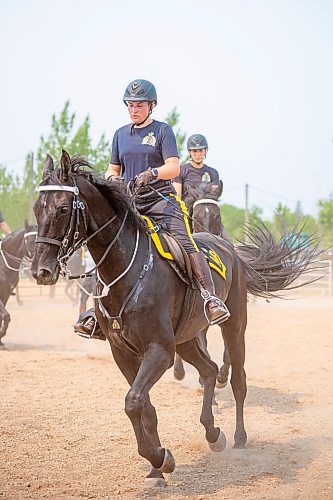 NIC ADAM / FREE PRESS
Members of the RCMP musical ride practice before their show at the Manitoba Stampede &amp; Exhibition Friday afternoon.
240719 - Friday, July 19, 2024.

Reporter: Jura