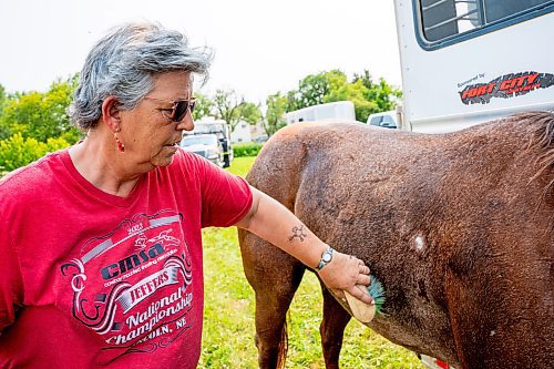 NIC ADAM / FREE PRESS
Cowboy Mounted Shooting Association president Herma Zomer pictured alongside her horse Lil&#x2019; Red at the Manitoba Stampede &amp; Exhibition Friday afternoon.
240719 - Friday, July 19, 2024.

Reporter: Jura