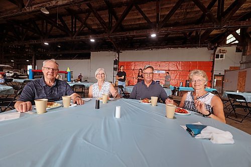 Ben Groening (left to right), Marg Groening, Jim Latimer and Anita Latimer enjoy pancakes and more at the Brandon Flight Centre's fly-in breakfast on Saturday. (Colin Slark/The Brandon Sun)