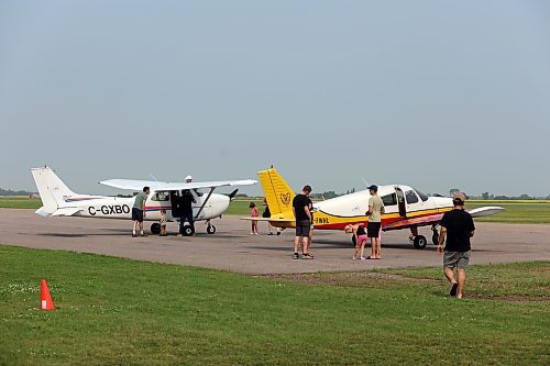 Passengers and pilots get ready for short sightseeing flights during the Brandon Flight Centre's fly-in breakfast on Saturday morning. (Colin Slark/The Brandon Sun)