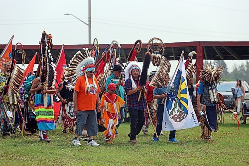 Rolling River First Nation Chief Wilfred McKay and other dignitaries enter the powwow arbour during the first of three grand entries at Rolling River's powwow on Saturday. (Colin Slark/The Brandon Sun)