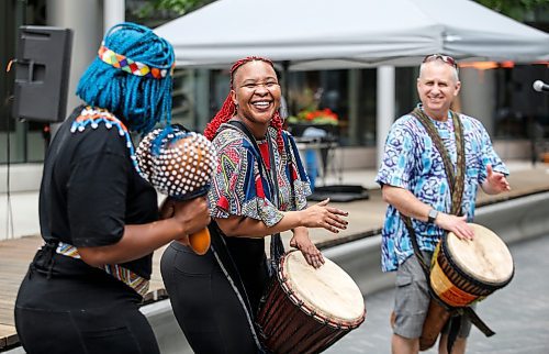 JOHN WOODS / FREE PRESS
Local African drummer Jay Stoller, right, and Soweto&#x2019;s Nosipho Mtotoba, left, and Tiny Modise who anchor the interactive drumming performance Ubuntu at The Fringe perform at Pegcity Steppers&#x2019; their Health And Wellness Day event at True North Square Sunday, July 21, 2024. 

Reporter: