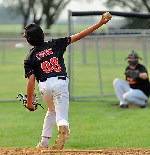 Wearing No. 88 on the back of his 15U AAA Brandon Marlins jersey, 13-year-old Madden Cheung is enjoying his third season of AAA baseball. Here, he warms up prior to taking the mound on Day 2 of Baseball Manitoba's provincial qualifying tournament held in Glenboro. Cheung's team qualified for Tier 2 provincials being held in Seine River from Aug. 2 to 4. (Photos by Jules Xavier/The Brandon Sun)