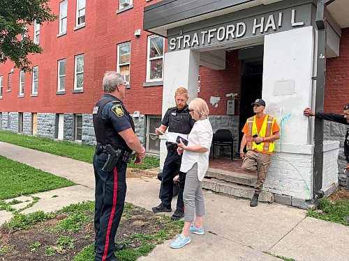 MALAK ABAS / WINNIPEG FREE PRESS
Stratford Hall, 285 College Avenue
St. Boniface Street Links director Marion Willis talking to police receiving a ticket for trespassing.

Inside 285 College Ave., where tenants were illegally evicted out of their homes the day after a new owner purchased the building. Tenants returned to their homes Monday only to find their appliances removed and a building in a further state of chaos.
240722 - Monday, July 22, 2024.