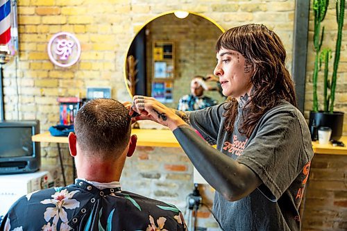 NIC ADAM / FREE PRESS
Cait Bousfield, owner of Good Fortune Barber Shop, speaks about Rubin Block while cutting Jesse Obers hair Monday
240722 - Monday, July 22, 2024.

Reporter: Matt

Jesse Ober