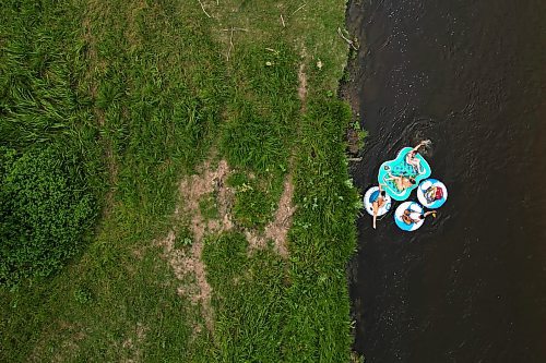 22072024
(L-R) Friends Loren Lobreau, Jodie Tocher, Luis Alvarenga and Cassandra Kowalchuk float down the Little Saskatchewan River west of Brandon on a hot and humid Monday afternoon. 
(Tim Smith/The Brandon Sun)default