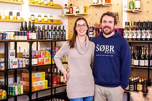 MIKAELA MACKENZIE / WINNIPEG FREE PRESS

Jessie and Shane Halliburton, co-owners of The Sobr Market, pose for a photo in their new store in the Exchange District in Winnipeg on Thursday, Feb. 2, 2023. For Gabby story.

Winnipeg Free Press 2023.