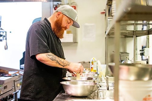 MIKAELA MACKENZIE / FREE PRESS

Chef Shaun Prevost makes chicken fingers at Rudy's Eat &amp; Drink on Tuesday, July 23, 2024. 

For Dave Sanderson story.