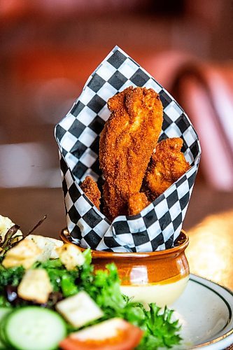 MIKAELA MACKENZIE / FREE PRESS

Chicken fingers and a side salad at Rudy's Eat &amp; Drink on Tuesday, July 23, 2024. 

For Dave Sanderson story.