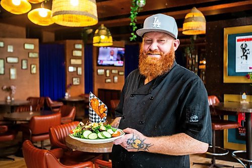 MIKAELA MACKENZIE / FREE PRESS

Chef Shaun Prevost with chicken fingers at Rudy's Eat &amp; Drink on Tuesday, July 23, 2024. 

For Dave Sanderson story.