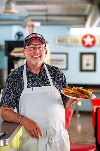 MIKAELA MACKENZIE / FREE PRESS

Owner Bruce Smedts with a plate of chicken fingers a the White Star Diner on Tuesday, July 23, 2024. 

For Dave Sanderson story.