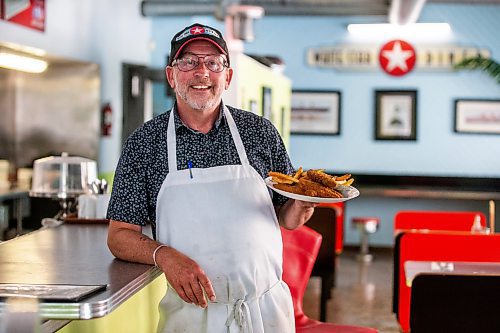 MIKAELA MACKENZIE / FREE PRESS

Owner Bruce Smedts with a plate of chicken fingers a the White Star Diner on Tuesday, July 23, 2024. 

For Dave Sanderson story.