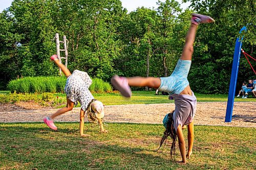 NIC ADAM / FREE PRESS
Friends from school, Paisley and Mia, do cartwheels at the nature playground at Assiniboine park Tuesday afternoon.
240723 - Tuesday, July 23, 2024.

Reporter: ?