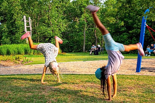 NIC ADAM / FREE PRESS
Friends from school, Paisley and Mia, do cartwheels at the nature playground at Assiniboine park Tuesday afternoon.
240723 - Tuesday, July 23, 2024.

Reporter: ?