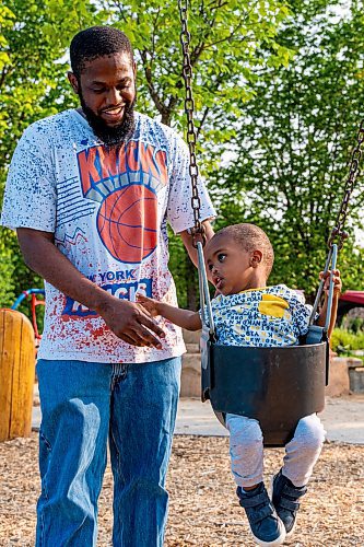 NIC ADAM / FREE PRESS
Kyle Grant and his two-year-old Bilal, from Georgia USA, play on the swings at the nature playground at Assiniboine park Tuesday afternoon.
240723 - Tuesday, July 23, 2024.

Reporter: ?