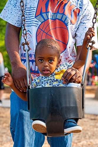 NIC ADAM / FREE PRESS
Kyle Grant and his two-year-old Bilal, from Georgia USA, play on the swings at the nature playground at Assiniboine park Tuesday afternoon.
240723 - Tuesday, July 23, 2024.

Reporter: ?