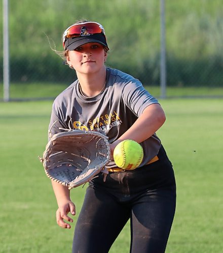 Jessa Church, 13, catches and plays third base and centre field for the under-13 Brandon Heat. She said her team, which hosts AA provincials this weekend, has been incredibly supportive with each other all season. (Perry Bergson/The Brandon Sun)
 