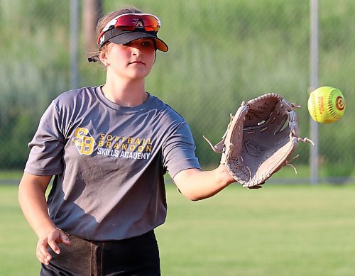 Jessa Church, 13, catches and plays third base and centre field for the under-13 Brandon Heat. She said her team, which hosts AA provincials this weekend, has been incredibly supportive with each other all season. (Perry Bergson/The Brandon Sun)
 