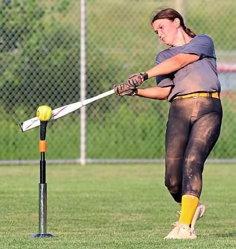 Jessa Church, 13, hits off a tee from centre field during a fun drill to end a recent  under-13 Brandon Heat practice. She said her team, which hosts AA provincials this weekend, has been incredibly supportive with each other all season. (Perry Bergson/The Brandon Sun)
 