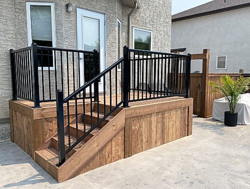 Photos by Marc LaBossiere / Free Press 
A treated lumber deck with black railing was positioned adjacent to an in-ground pool.
