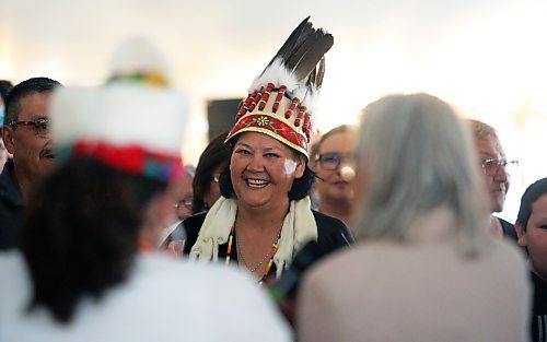 Wearing a ceremonial headress, Assembly of Manitoba Chiefs Grand Chief Cathy Merrick takes her oath of office following her first-ballot election victory for the position on Wednesday afternoon during the 36th Annual General Assembly that was held on Waywayseecappo First Nation land near Brandon. (Matt Goerzen/The Brandon Sun)