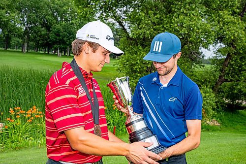 NIC ADAM / FREE PRESS
Braxton Kuntz, of Breezy Bend Country Club, cheers with his caddy, Jacob Armstrong, after winning the Manitoba men's amateur championship at Rossmere Golf &amp; Country Club Wednesday.
240724 - Wednesday, July 24, 2024.

Reporter: Mike McIntyre