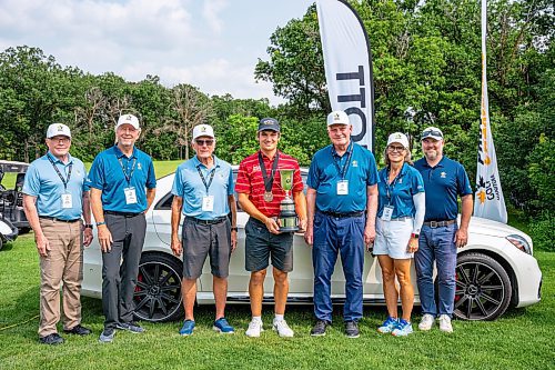 NIC ADAM / FREE PRESS
Braxton Kuntz (centre), of Breezy Bend Country Club, pictured with his trophy and Golf MB volunteers after the Manitoba men's amateur championship at Rossmere Golf &amp; Country Club Wednesday.
240724 - Wednesday, July 24, 2024.

Reporter: Mike McIntyre