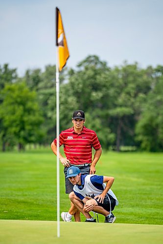 NIC ADAM / FREE PRESS
Braxton Kuntz, of Breezy Bend Country Club, and his caddy, Jacob Armstrong, play in the final round of the Manitoba men's amateur championship at Rossmere Golf &amp; Country Club Wednesday.
240724 - Wednesday, July 24, 2024.

Reporter: Mike McIntyre