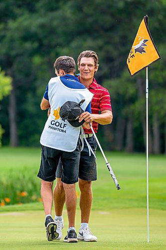 NIC ADAM / FREE PRESS
Braxton Kuntz, of Breezy Bend Country Club, cheers with his caddy, Jacob Armstrong, after winning the Manitoba men's amateur championship at Rossmere Golf &amp; Country Club Wednesday.
240724 - Wednesday, July 24, 2024.

Reporter: Mike McIntyre