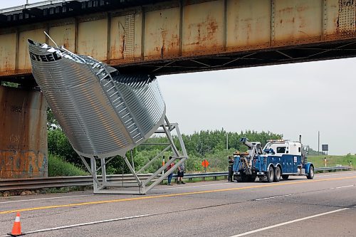 A grain bin carried by a Heritage Co-op truck got stuck under a CN Rail overpass on Thursday morning, requiring the use of a tow truck to extricate it. The incident happened on Highway 10, about 10 kilometres north of Brandon Municipal Airport. (Colin Slark/The Brandon Sun)