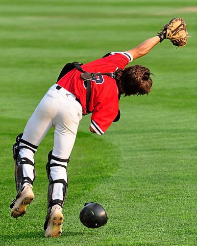 Trying to the foul ball in the sun during Wednesday night's Brandon Senior AA Baseball League post-season game, Westman Fire Protection Cubs catcher J.T. Martine managed to catch it despite being off balance. (Jules Xavier/The Brandon Sun)