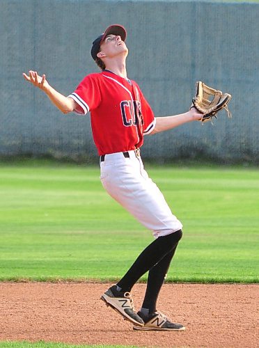 Where is it, asks Westman Fire Protection Cubs second baseman Carter Loewen, who lost the ball in the setting sun during Game 1 of his team's semifinal series with the GW Vacuum Truck Service Young Guns. Later in the game at Andrews Field, Loewen came on in relief and earned the save in a 4-3 triumph after he knocked in the winning run scored by teammate Ty Gywnne. (Jules Xavier/The Brandon Sun)