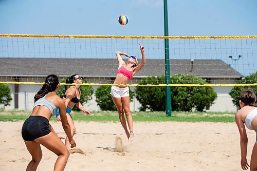 MIKAELA MACKENZIE / FREE PRESS

Avery Cook (19) spikes the ball in a game of beach volleyball at Sargent Park as part of the Blazers Volleyball Academy beach volleyball summer camp on Thursday, July 25, 2024. 

Standup.