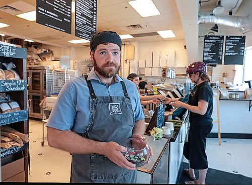 Ruth Bonneville / Free Press

Local - Hildegard's Bakery on Portage

Dave Newsom with Hildegard's Bakery, holding button bowl, which is a type of pay-it-forward system offering coffee or muffin to those in need coming into the bakery.  

See story on thefts in area. 

July 25th,  2024

