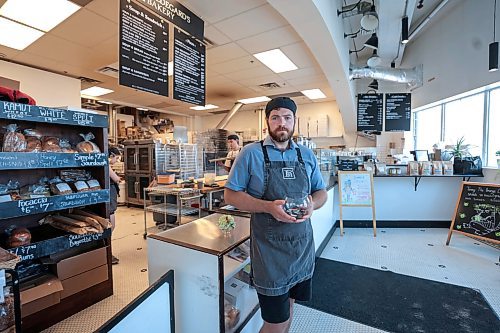 Ruth Bonneville / Free Press

Local - Hildegard's Bakery on Portage

Dave Newsom with Hildegard's Bakery, holding button bowl, which is a type of pay-it-forward system offering coffee or muffin to those in need coming into the bakery.  

See story on thefts in area. 

July 25th,  2024

