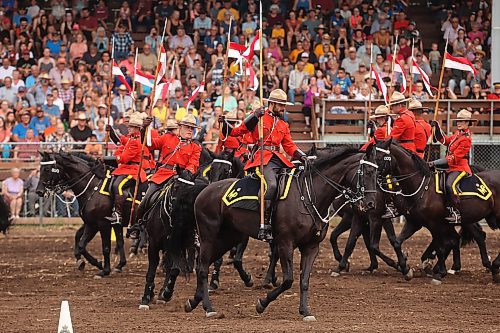 25072024
Members of the RCMP Musical Ride perform at the first go-round of the 68th Annual Manitoba Threshermen&#x2019;s Reunion and Stampede rodeo near Austin, Manitoba on Thursday evening.  (Tim Smith/The Brandon Sun)